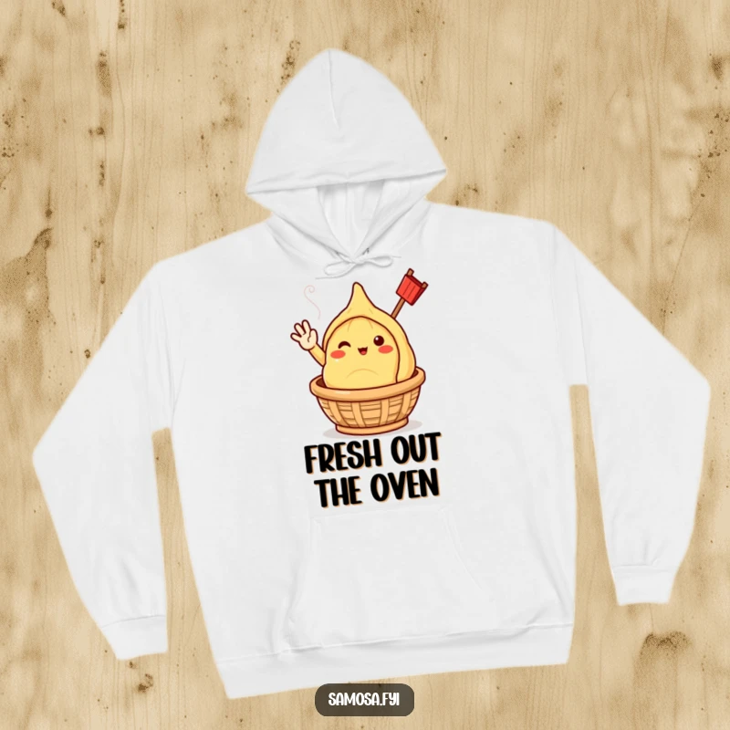 Cozy hoodie featuring a funny samosa character cheerfully waving, emerging from a steaming basket.