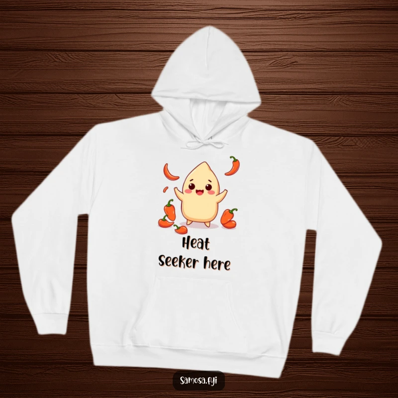 Funny hoodie featuring a smiling samosa juggling tiny chili peppers, designed for warmth and a humorous, spicy flair.