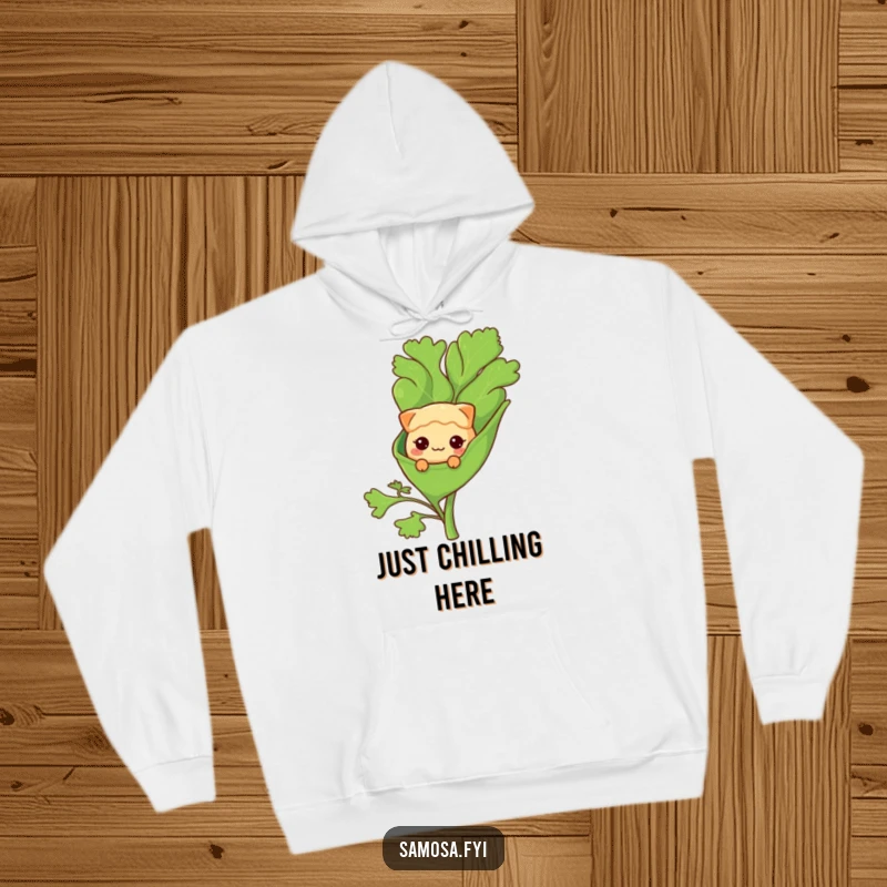 Funny Hoodie: A shy samosa character peeks from a giant coriander leaf, offering cozy, humorous comfort.