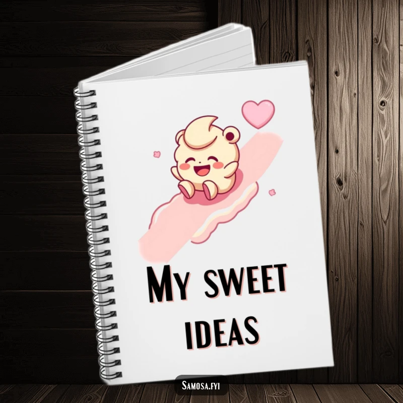 Funny notebook adorned with a giggling laddoo character rolling with joy down a sweet slope, great for note-taking.